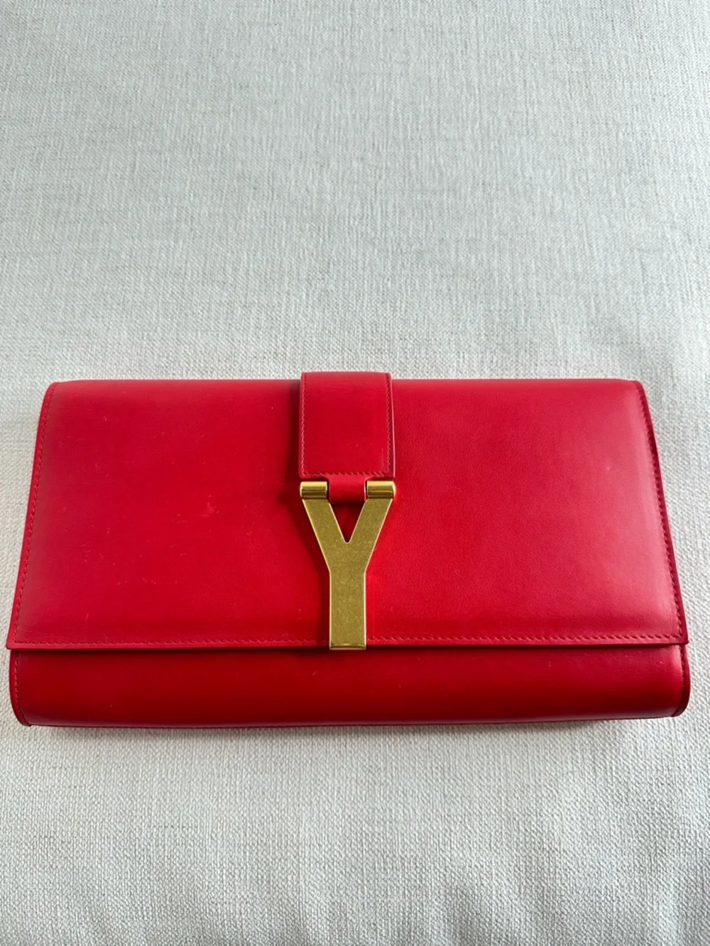 SOLD. Yves Saint Laurent Red Leather Clutch with Gold Y Emblem - Picture 2 of 15